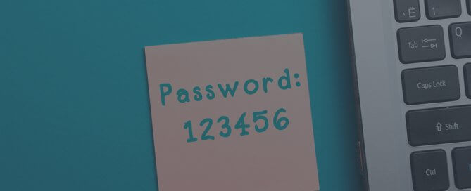 A tan sticky note that says "password 123456.'"
