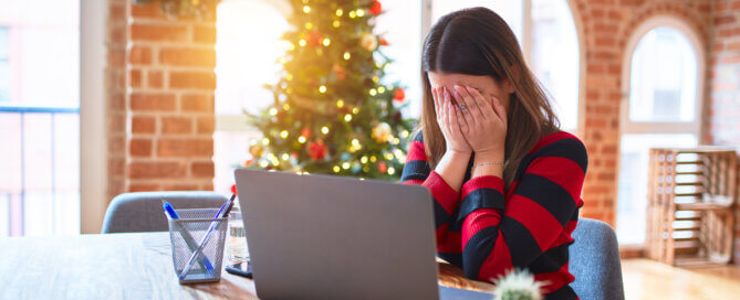 Woman sitting at the table working with laptop