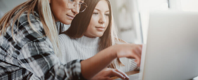 Mother and child on computer at home