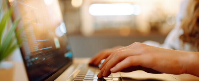 Female hands working on a laptop